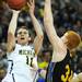 Michigan freshman Nik Stauskas shoots the ball around South Dakota State senior tony Fiegen in the first half of the second round of the NCAA tournament at the Palace in Auburn Hills on Thursday, March 21, 2013. Melanie Maxwell I AnnArbor.com
